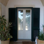 persiana verde Raffaello con infisso bianco perla in pvc